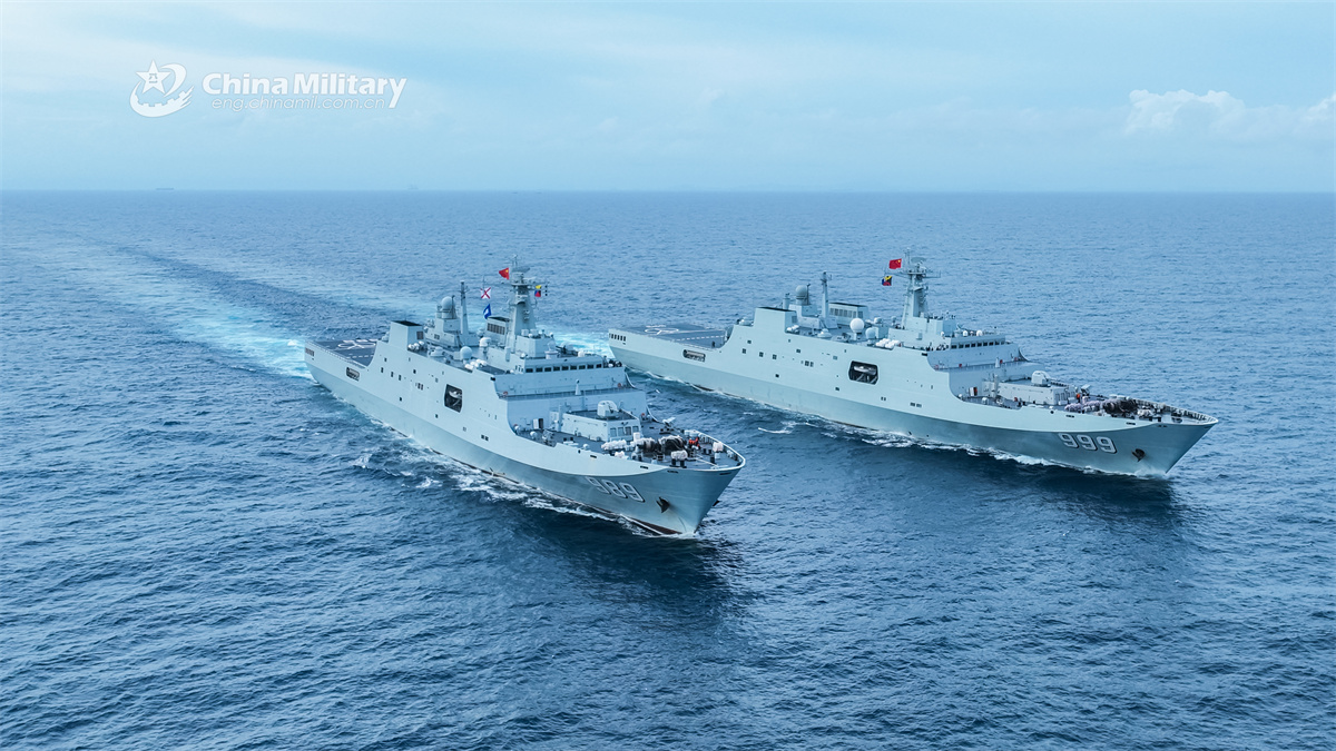Amphibious dock landing ships sail in formation